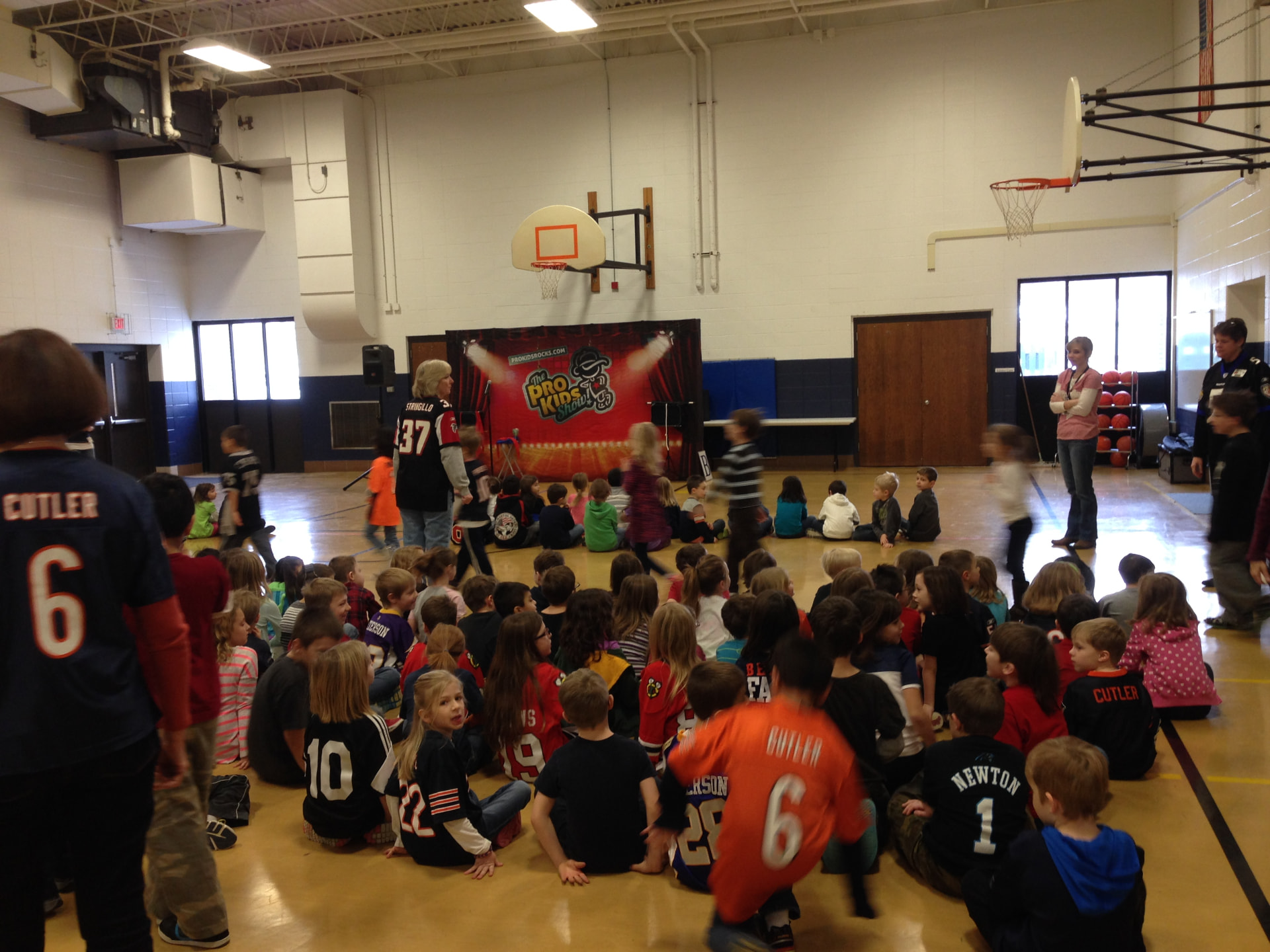 West Elementary students in sports jerseys before Tim's year two show