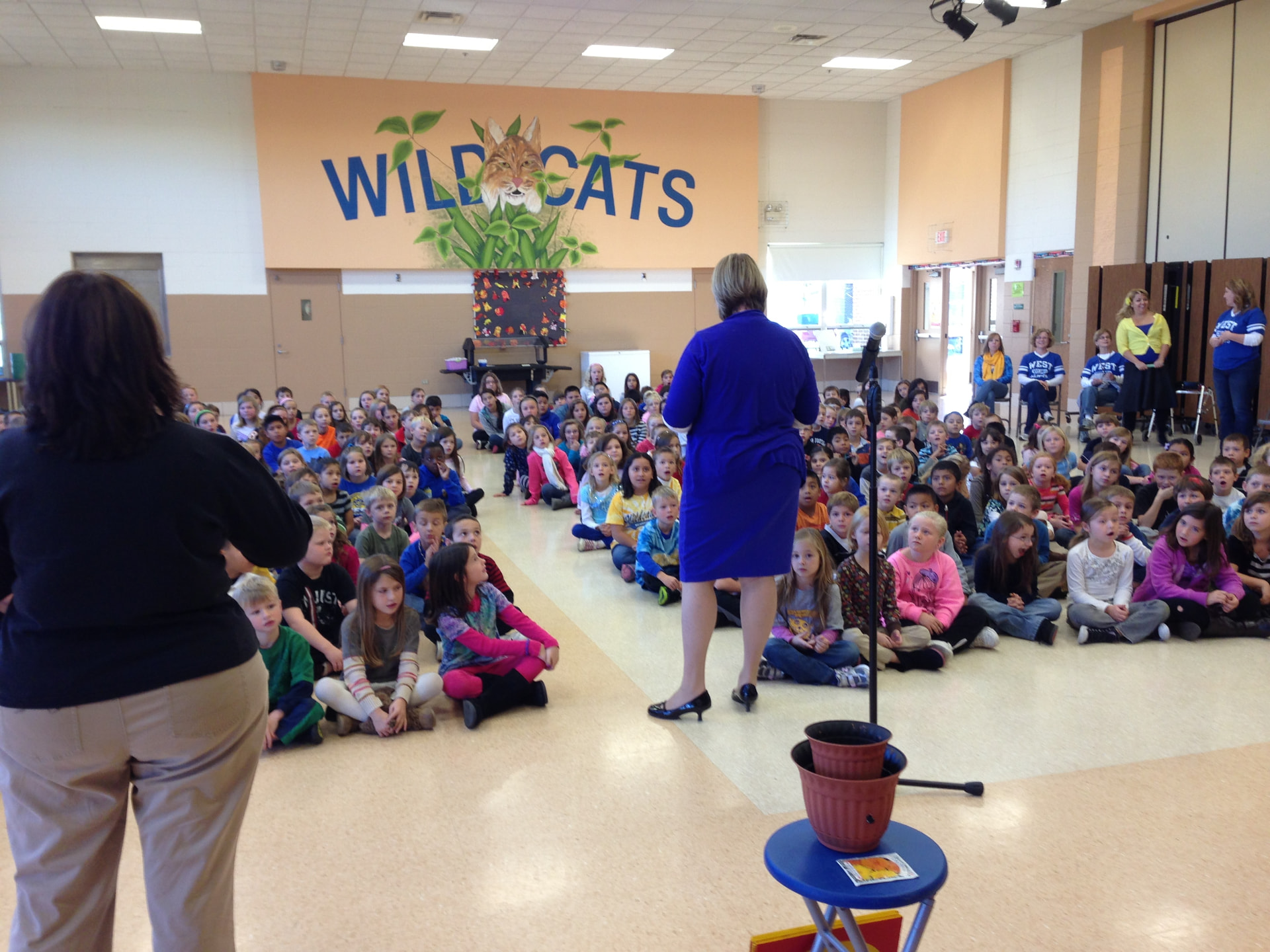 West Elementary students gathered under the Wildcats mural for The Pro-Kids Show