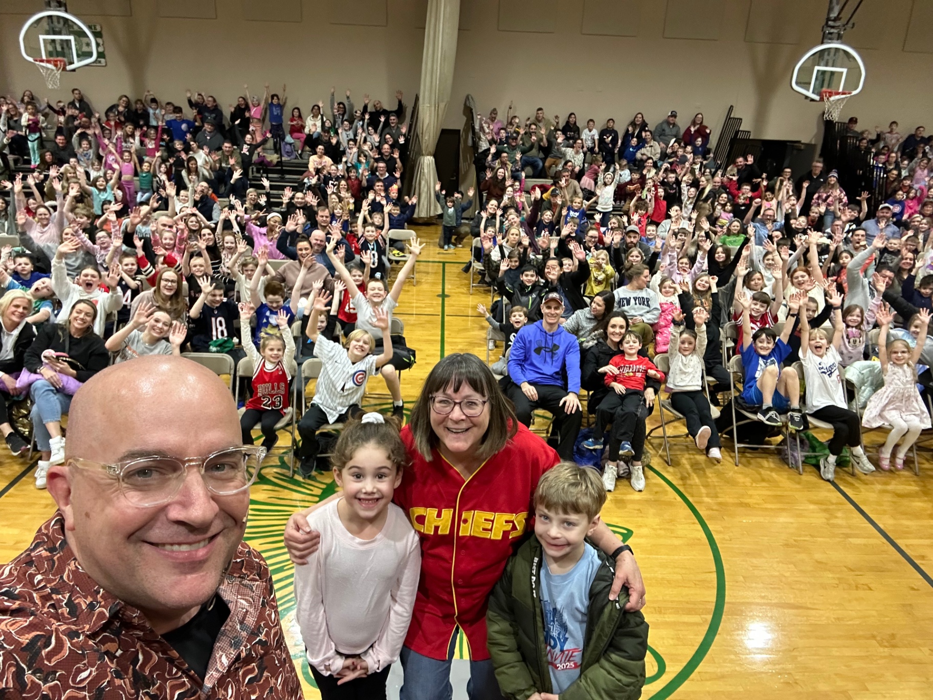 Catholic school Family Night with the principal on stage