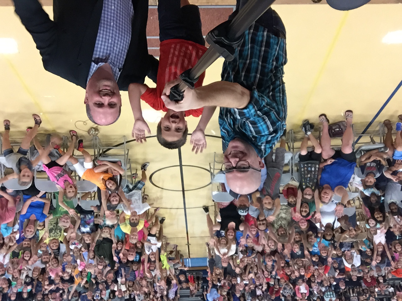Tim and onstage helpers in front of a huge Prairie View Family Night crowd in 2016