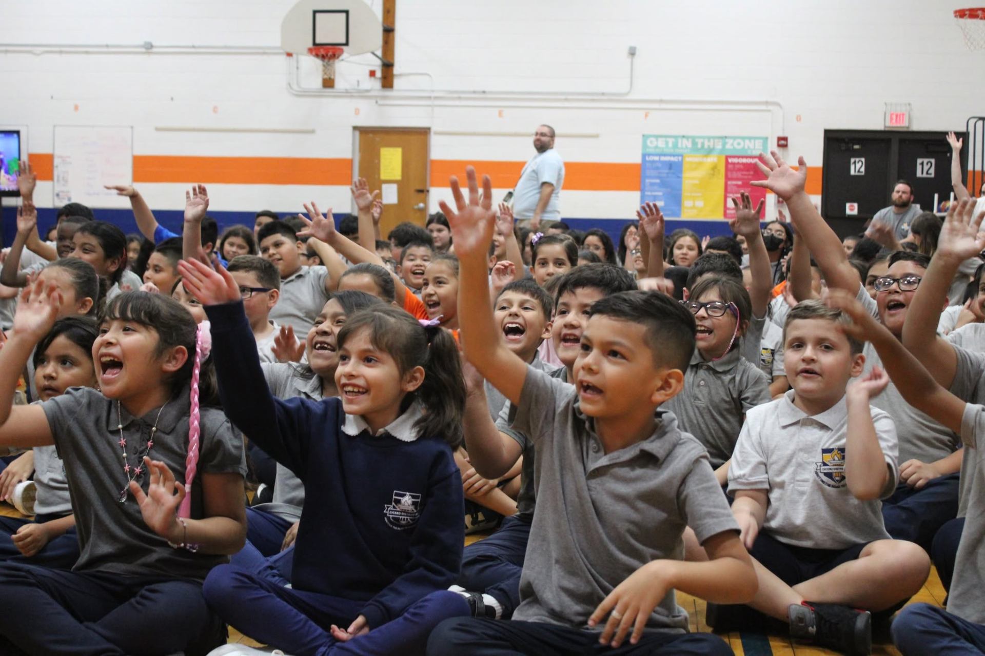 Elementary students fully engaged during a school assembly