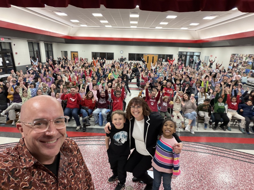 Principal selfie with a packed Family Night crowd