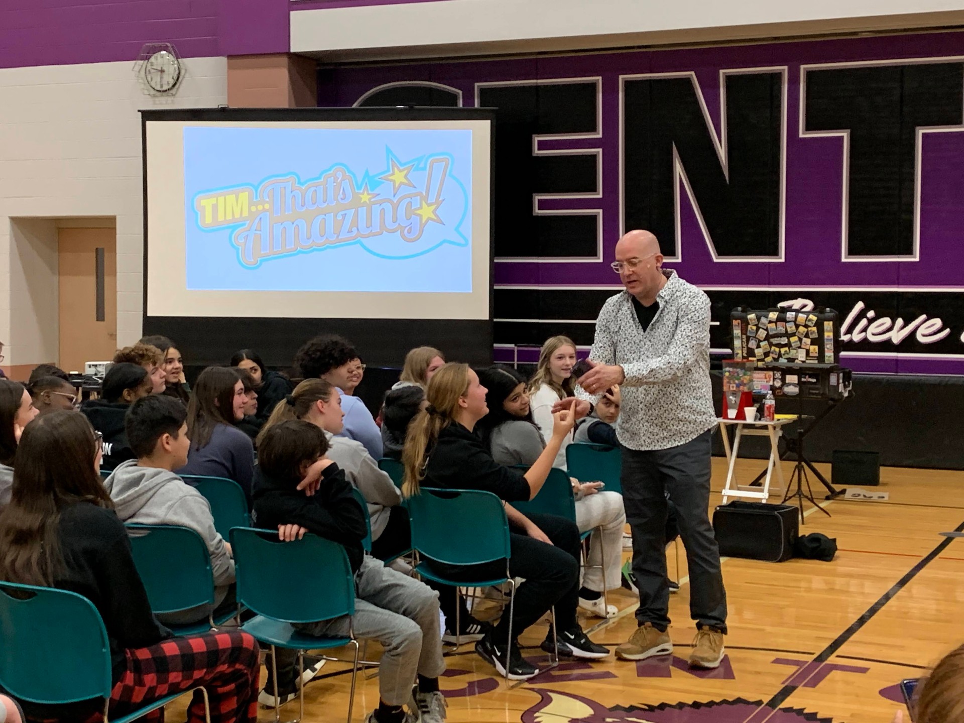 Middle school volunteer with a cell phone routine