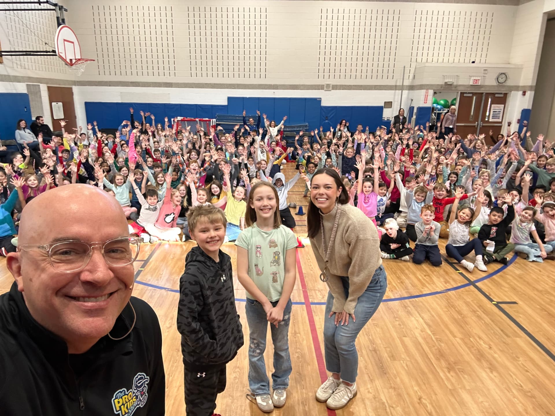 Students and staff at Longfellow Elementary after a Pro-Kids Show assembly