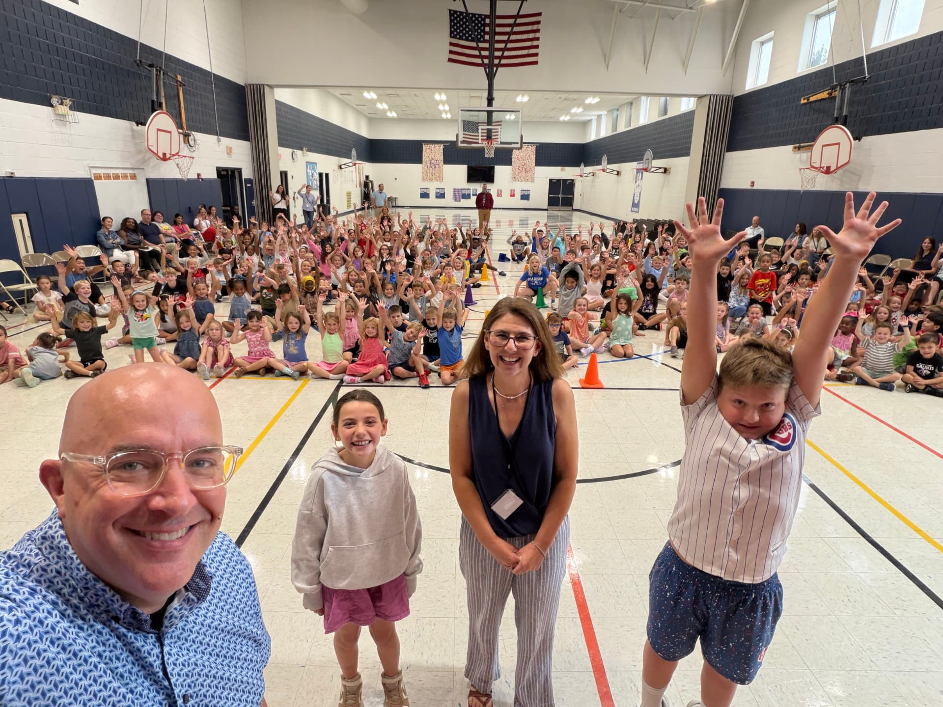 A gym full of cheering Madison Elementary students during a second assembly